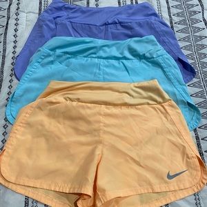 Three pairs size XS Nike running shorts
